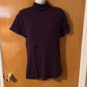 Turtleneck sweater with buckle sleeve detail